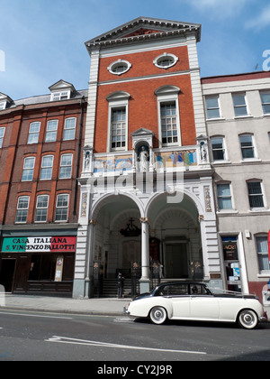 A Rolls Royce parked outside St. Peter's Italian church waiting for a wedding party Clerkenwell Road,London England UK Stock Photo