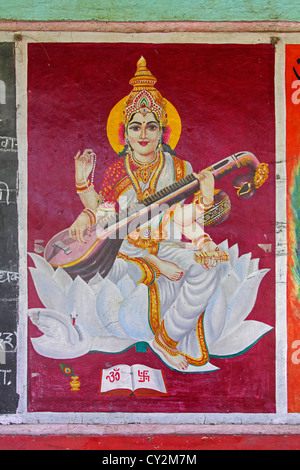 Painting of sarasvati, goddess of speech and eloquence drawing on a slate, India Stock Photo