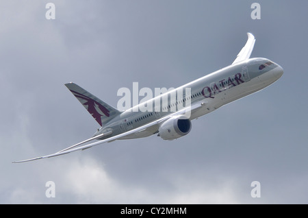 Boeing 787 Dreamliner in Qatar Airways colours displaying against a grey sky at Farnborough International Airshow 2012 Stock Photo