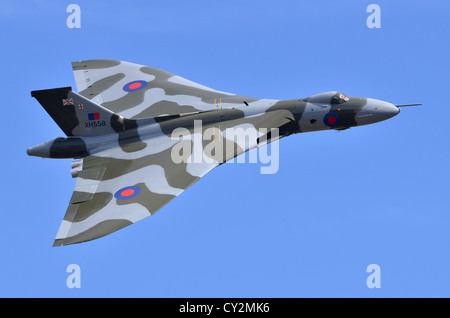 Avro Vulcan bomber aircraft in RAF camouflage displaying at Duxford Airshow. Vulcan B2 XH558 was the last flying V Bomber. Stock Photo