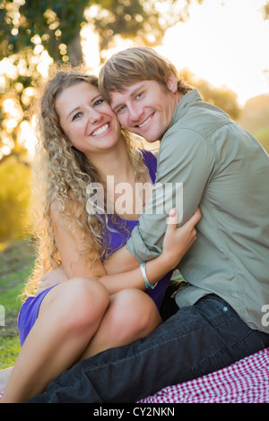 An Attractive Couple Enjoying A Day in the Park Together. Stock Photo