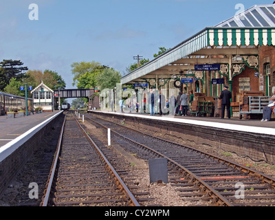 Passengers  waiting on the platform for the next steam train to arrive at Sheringham station in North Norfolk Norfolk England Stock Photo