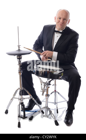 man in tuxedo playing drums isolated on white Stock Photo