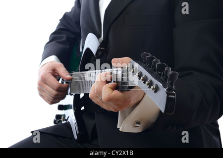 formal man playing guitar isolated on white background Stock Photo