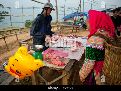 Flower Hmong Woman Buying Meat In Sapa Market, Vietnam Stock Photo