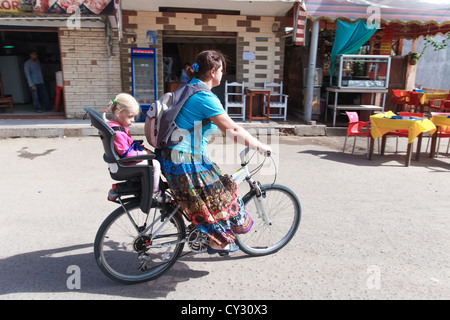 Woman on a bicycle with daughter Stock Photo