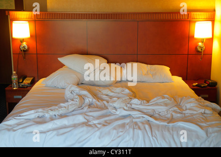 Boston Massachusetts,Courtyard Marriott South Boston,motel,hotel hotels lodging inn motel motels,guest room,king size bed,headboard,lamp,unmade,pillow Stock Photo