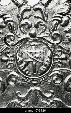 Detail of an old hammered aluminum religious art Stock Photo