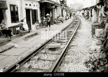 Life beside the train tracks in Old City of Hanoi in Vietnam in Far East Southeast Asia. Slum Rail Railway Poverty Urban Reportage Lifestyle Travel Stock Photo