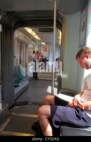 Boston Massachusetts,MBTA,T,Green Line,subway,train,train,outbound train,riders,man men male adult adults,sitting,MA120821040 Stock Photo