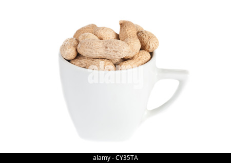 Peanuts in a white cup against a white background. Stock Photo