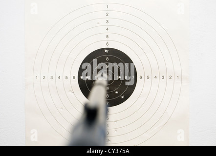 Air rifle shooting target on wall Stock Photo