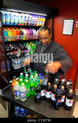 Boston Massachusetts,Courtyard Marriott South Boston,motel,hotel,lobby,Black minorities,man men male adult adults,moving,delivering,drink drinks,bottl Stock Photo