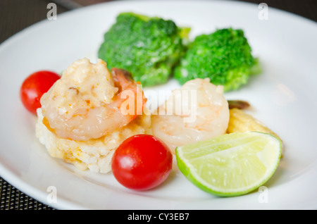 Crispy rice cake and shrimp dipping ( rice fried and shrimp sauce on top), and vegetable Stock Photo