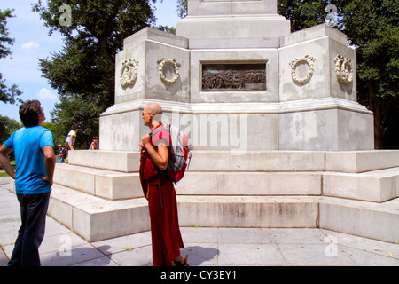 Boston Massachusetts,Boston Common,public park,Soldiers and & Sailors Monument,memorial,man men male adult adults,Buddhist monk,robe,kashaya,visitors Stock Photo