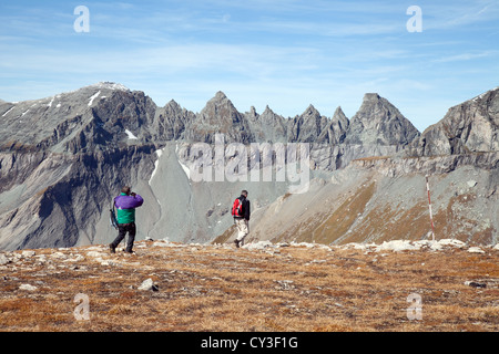 Walkers at the UNESCO World heritage site Glarus thrust, Swiss alps at Flims,  Switzerland europe Stock Photo