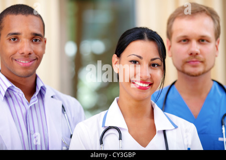 Multi-ethnic team of confident happy doctors Stock Photo