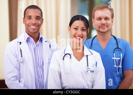 Multi-ethnic team of confident happy doctors Stock Photo