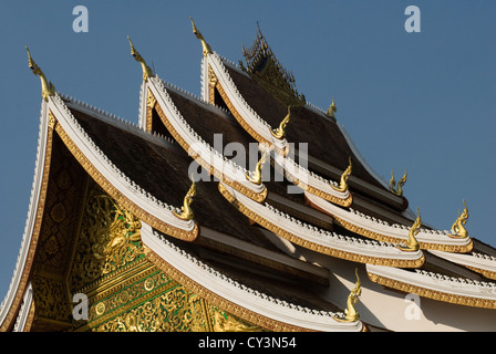 A detail of the roof of Haw Pha Bang temple in the grounds of the Royal Palace in Luang Prabang, Laos Stock Photo