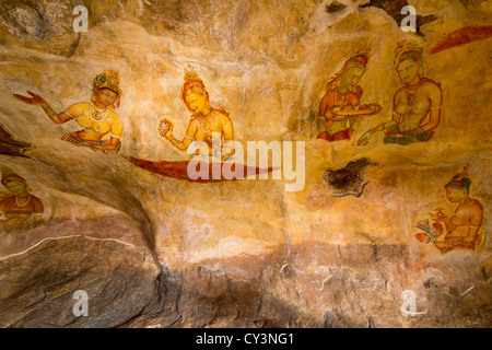 Ancient wall paintings of cloudy maidens at Sigiriya Lion's rock palace Stock Photo