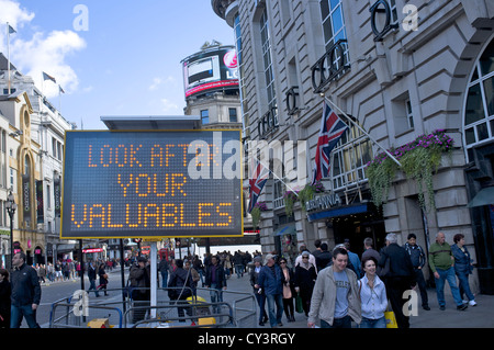 Look after your valuables illuminated sign in Piccadilly Circus London Stock Photo