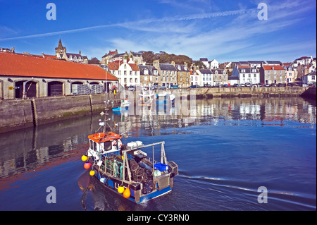 Fishing boat approaching the Fish Market in Pittenweem harbour East Neuk of Fife Scotland to land the catch of the day. Stock Photo
