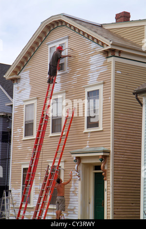 Newport Rhode Island,New England,Barney Street,house houses painter,ladder,tall,high,Black Blacks African Africans ethnic minority,man men male adult Stock Photo