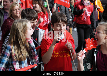 Group of children marching on TUC march anti-austerity march rally 'A Future That Works', central London, UK Stock Photo