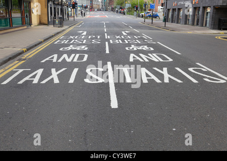 Road signs instructing traffic to turn right or left except buses, bicycles and taxis in Glasgow city centre, Stockwell Street, Scotland UK Stock Photo