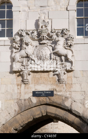 the royal coat of arms above the middle tower archway at the tower of london, england Stock Photo