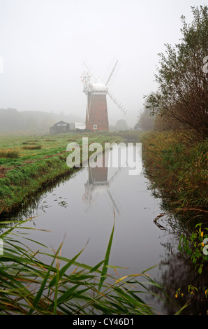 A view of Horsey Mill in autumn mists on the Norfolk Broads at Horsey, Norfolk, England, United Kingdom. Stock Photo