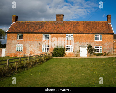 Traditional long-house farmhouse divided into two homes, Boyton, Suffolk, England Stock Photo