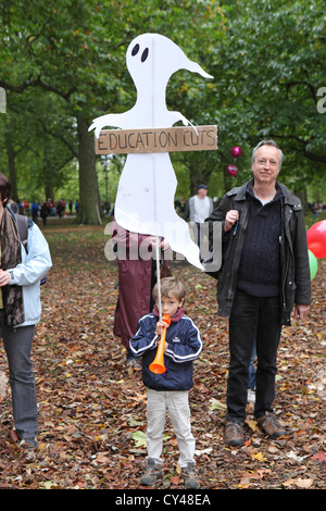 Child holding placard. Anti-austerity and education cuts protest at A Future That Works London UK Stock Photo