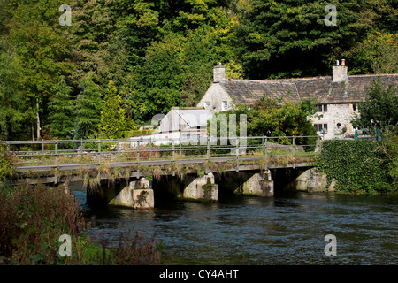 Old cottages in Monsal Dale next to the River Wye. Stock Photo
