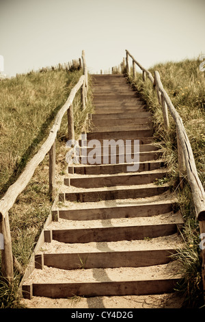 Stairs to the top of a dune. Netherlands. Toned and vignetted image Stock Photo