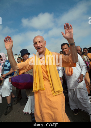 Members of the Hare Krishna movement gather to sing and dance on the seafront at Brighton. Stock Photo