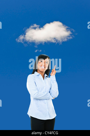 Smiling black woman thinking about cloud computing Stock Photo