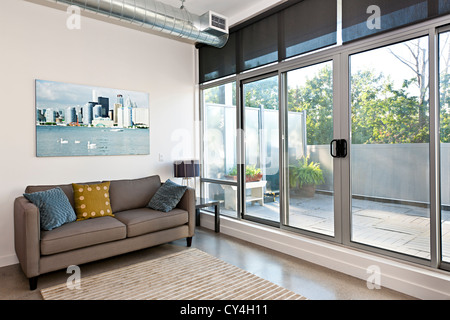 Living room with sliding glass door to balcony - artwork from photographer portfolio Stock Photo