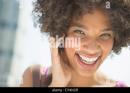 USA, New Jersey, Jersey City, Portrait of woman laughing Stock Photo