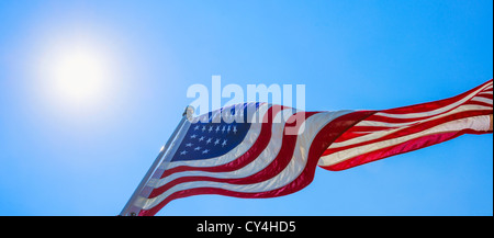 USA, New Jersey, Jersey City, US flag against blue sky Stock Photo