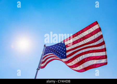 USA, New Jersey, Jersey City, US flag against blue sky Stock Photo