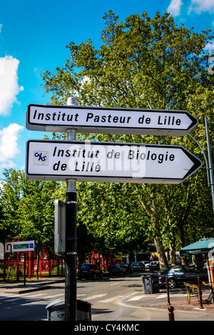 French city road sign pointing to the Institut Pasteur and Biologie in Lille Stock Photo