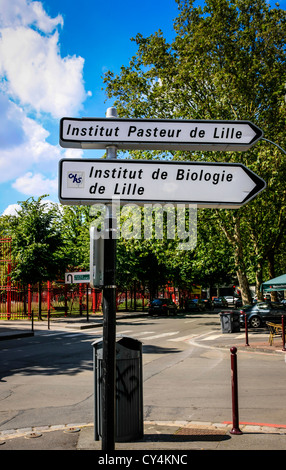 French city road sign pointing to the Institut Pasteur and Biologie in Lille Stock Photo