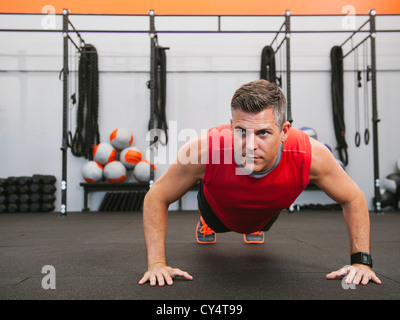 USA, California, Laguna Niguel, Mature man doing push-ups Stock Photo