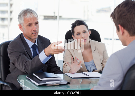 Human resources managers having an interviewing an employee Stock Photo