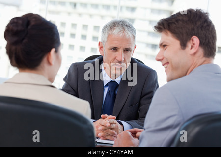 Entrepreneurs having a meeting with their banker Stock Photo