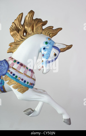 Colorful carousel horse isolated on white background Stock Photo
