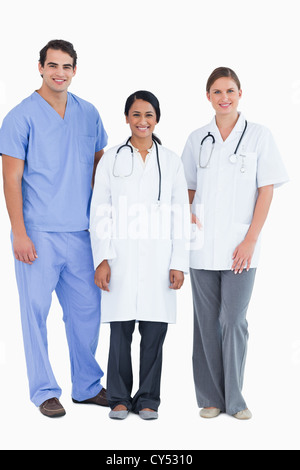 Smiling young medical staff standing together Stock Photo