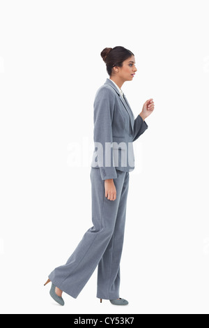 Side View of a Black Businesswoman walking in side view isolated on a ...