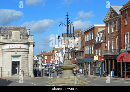 Fountain and signposts at junction of London Road and Sevenoaks shopping High Street with HSBC bank branch blue sky sunny day in Kent England UK Stock Photo